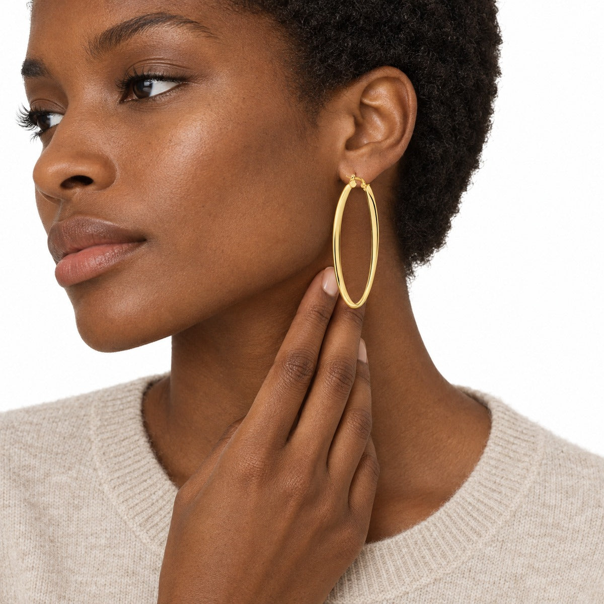 Aria Large Oval Hoop Earrings – Yellow Gold on model 3